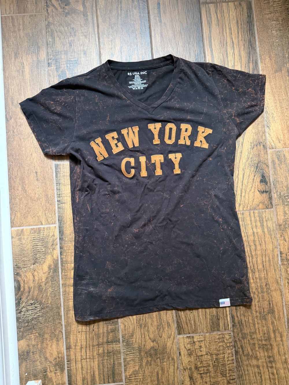 NEW YORK CITY Short Sleeve V-Neck Tee in Black with Orange Print